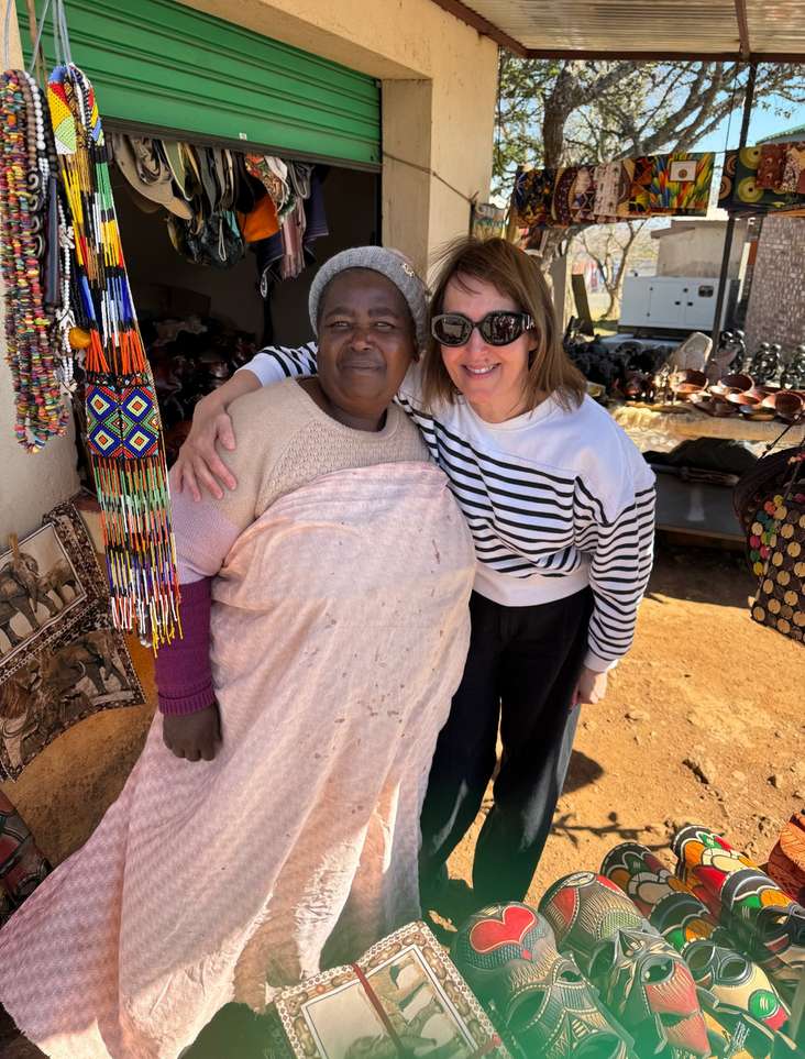 The writer with Mary, a stallholder at an arts and crafts market along the Panama route
(Photo: Denise McHugh)
